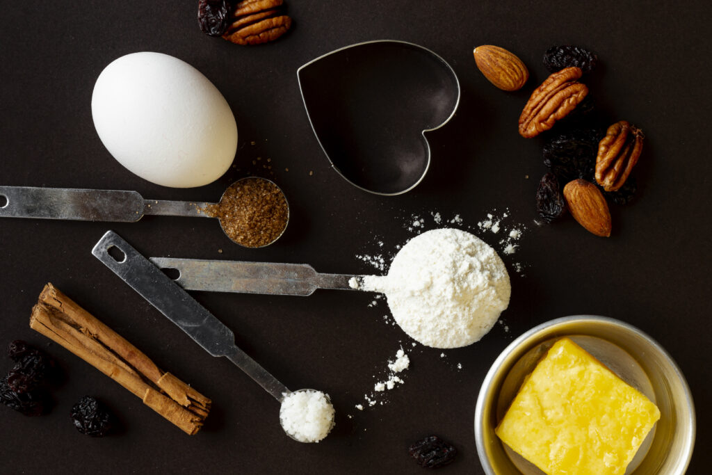 Hands masterfully preparing Jet Puffed Fudge in a kitchen, showcasing the cooking process with a focus on texture and consistency.