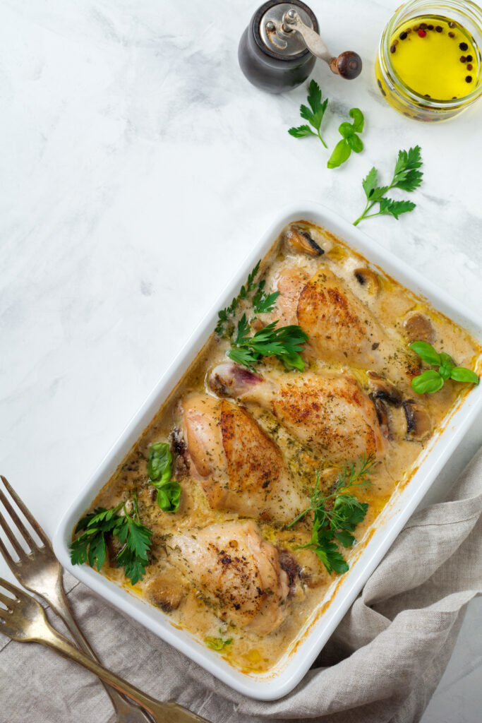 A beautifully served chicken cobbler on a dining table, accompanied by side dishes, perfect for a comforting family dinner.