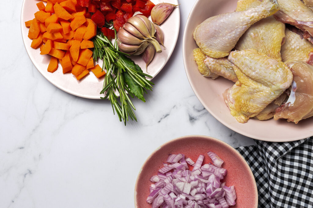 Ingredients for chicken cobbler being prepared on a kitchen counter, showcasing the simplicity and ease of the recipe