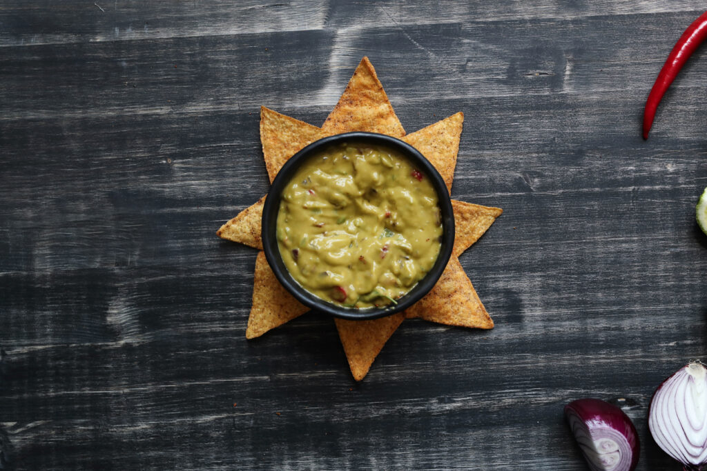 Snacks. Delicious nachos with guacamole