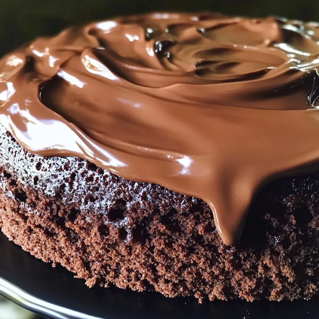Vegan gluten free chocolate cake recipe made with almond flour and topped with ganache